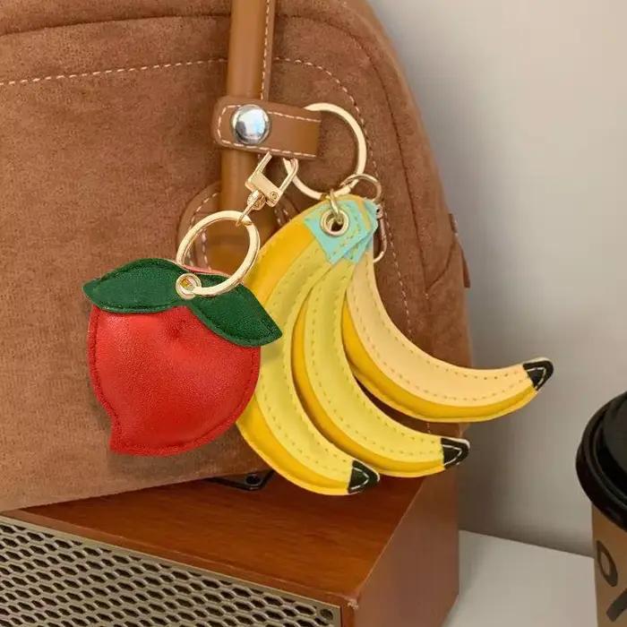 Porte-clés en cuir PU pour femmes, mignon, banane, pêche, breloques, fruits, pendentifs de sac, étanche, accessoires de sac, décor de mode