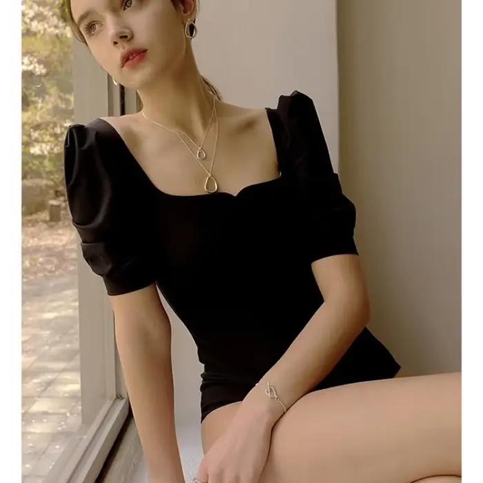 Maillot de bain une pièce noir à manches mi-longues pour femmes